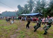 Meriahkan HUT RI ke-79: Satgas TMMD Kodim 0311 Pesisir Selatan Ikuti Lomba Tarik Tambang Bersama Masyarakat